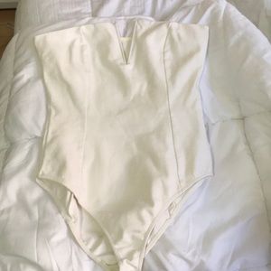 Structured cream bodysuit with V-cutout